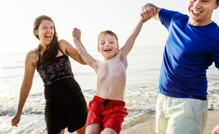A family playing at the beach